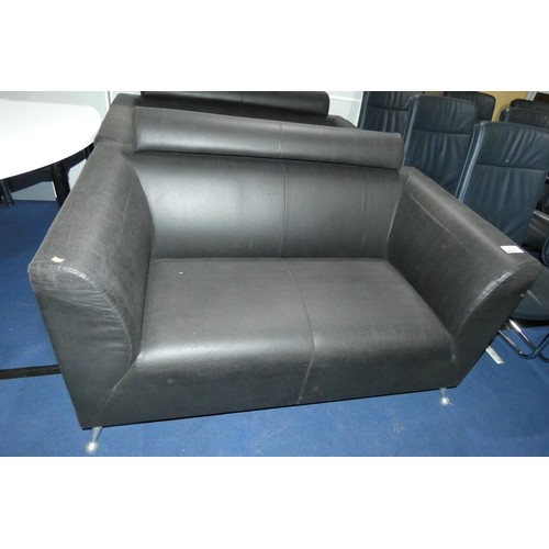 2317 - A dark brown upholstered two person reception sofa approx 145cm wide