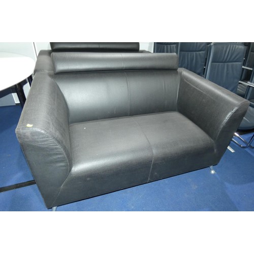 2318 - A dark brown upholstered two person reception sofa approx 145cm wide