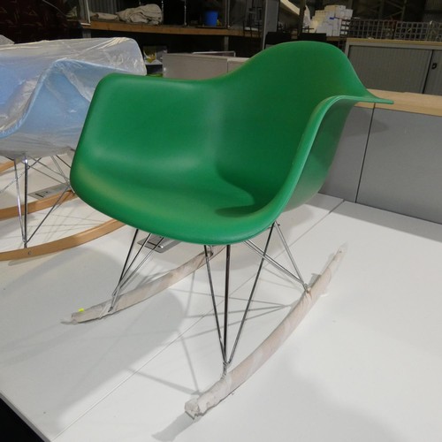 2320 - A plastic / wood / metal rocking chair - green