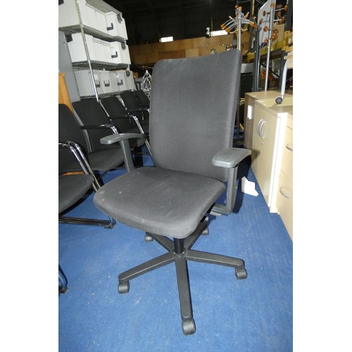 2369 - 1 x black upholstered office swivel chair by Konig and Neurath. Please note that the arm rest is dam... 