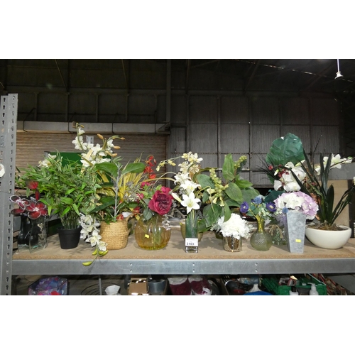 3103 - A quantity of various artificial flowers mainly in cases / pots. Contents of 1 shelf