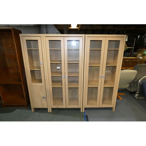 3160 - 2 x wood effect double door display cabinets each approx 81cm w / 180cm high and a matching single d... 