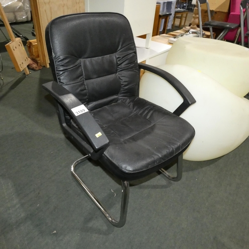 3189 - A black upholstered cantilever chair