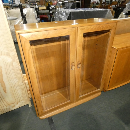 3206 - An Ercol cabinet with two glass doors approx 91 cm wide / 98cm high