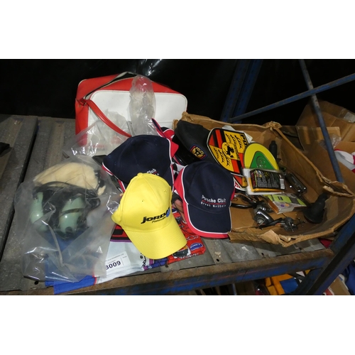 3009 - A quantity of various items including motoring racing related items comprising caps, flags, a Team C... 