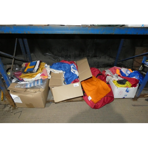 3013 - A quantity of various motor racing and other flags etc. Contents of 1 shelf