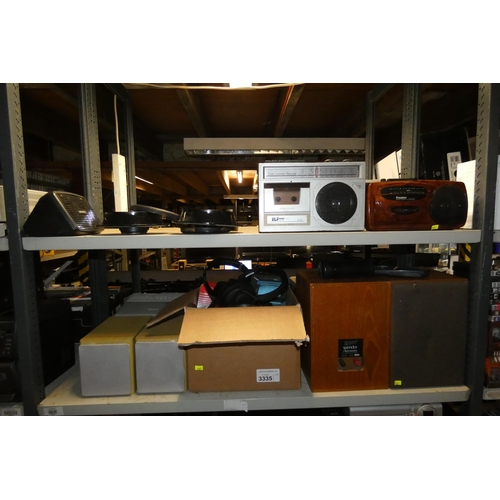 3335 - A quantity of various electronic related items including radios, speakers, headphones etc, contents ... 