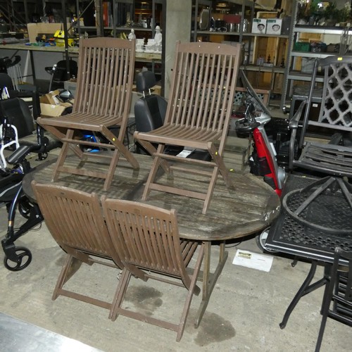 3056 - An oval wooden garden dining table approx 180 x 100cm and 4 x folding wooden chairs