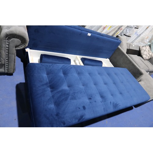 1384 - A blue upholstered sofa bed approx 200cm wide. Please note that this sofa bed is missing both the en... 