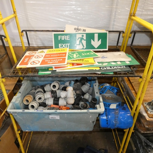 5021 - A quantity of various plastic pipe fittings, warning signs etc. Contents of 2 shelves