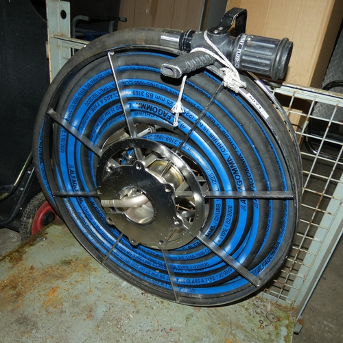 5071 - A fire hose on a stainless steel reel