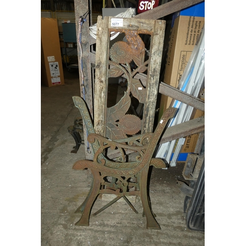 5077 - A pair of metal garden bench ends and a metal bench back