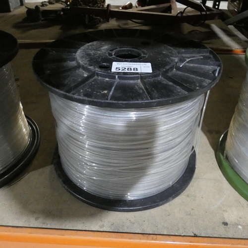 5288 - 1 reel containing plastic strimmer line - There is a lot of strimmer line on this reel but exact len... 