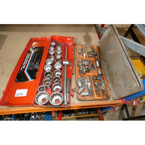 5315 - A red metal case containing a socket set and 1 metal box containing various sockets. Not practical t... 