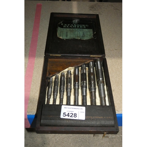 5428 - An 8 piece expanding reamer set in a wooden case by T & J