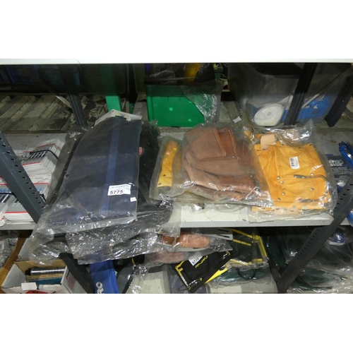 5775 - A quantity of various tool bags, leather tool / nail pouches etc. Contents of 1 shelf