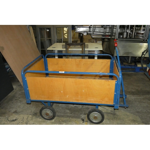 6104 - A blue metal wheeled warehouse trolley with sides