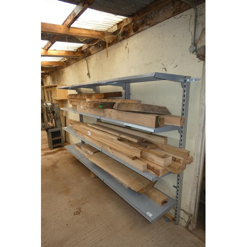 35 - A grey metal bolt to wall four shelf storage rack approx 3m wide. Please note that the Oak shown in ... 