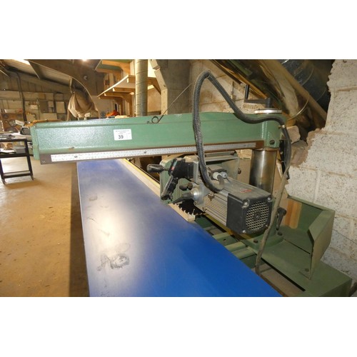 39 - A Maggi cross cut radial arm saw 3ph. This is a free standing saw that sits under the end of the tab... 