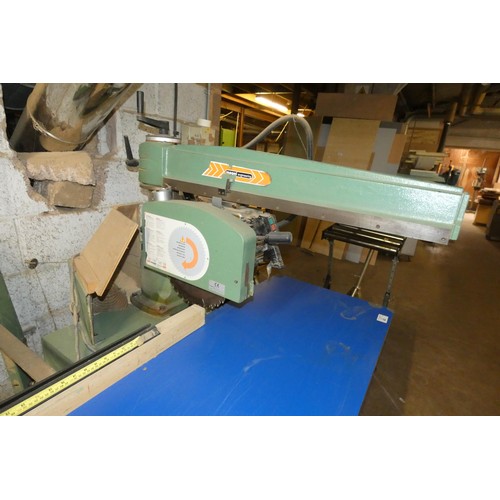 39 - A Maggi cross cut radial arm saw 3ph. This is a free standing saw that sits under the end of the tab... 