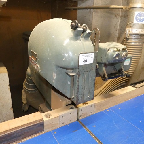 40 - A Wadkin cross cut radial arm saw number CC3914, 3ph with a wide work feed in / out table (approx 5.... 