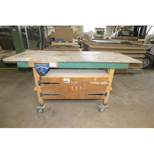 46 - A wheeled work bench with a Record wood workers vice attached approx 185 x 78 x 102cm high