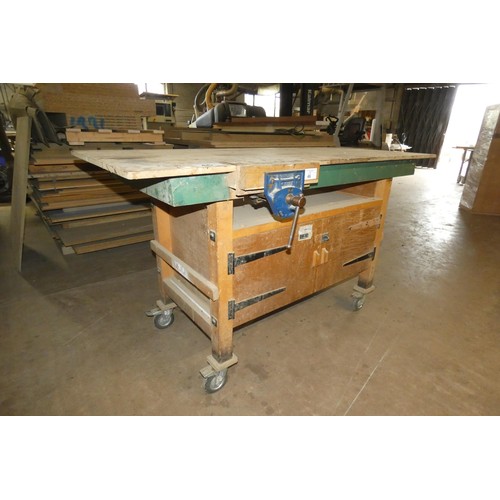 46 - A wheeled work bench with a Record wood workers vice attached approx 185 x 78 x 102cm high