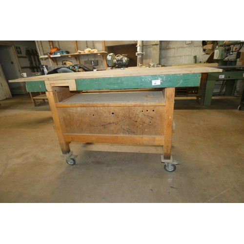 46 - A wheeled work bench with a Record wood workers vice attached approx 185 x 78 x 102cm high