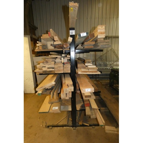 62 - A black metal five level double sided storage rack overall approx 3.15m wide x 2m high. The wood whi... 