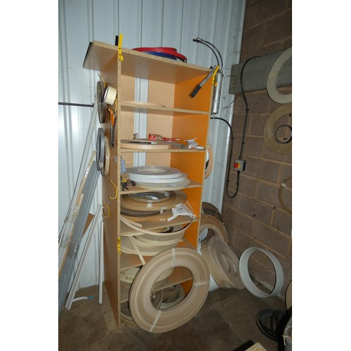 77 - A quantity of various rolls of edge banding material (the orange storage rack is also included)