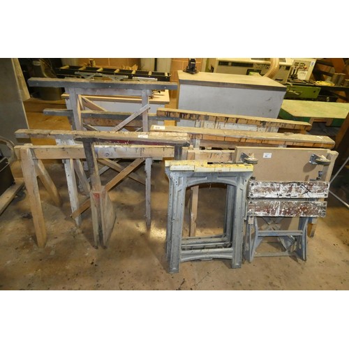 88 - 8 x various wooden trestles / stands, 2 x plastic folding saw horses, a wheeled skate and a Workmate... 