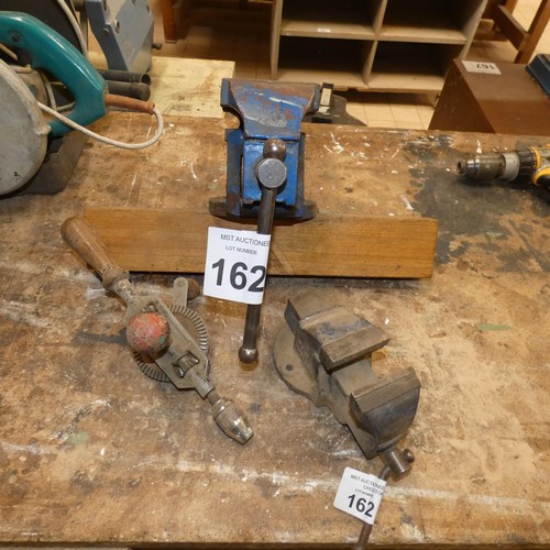 162 - A bench vice, a small vice and a Stanley hand operated drill