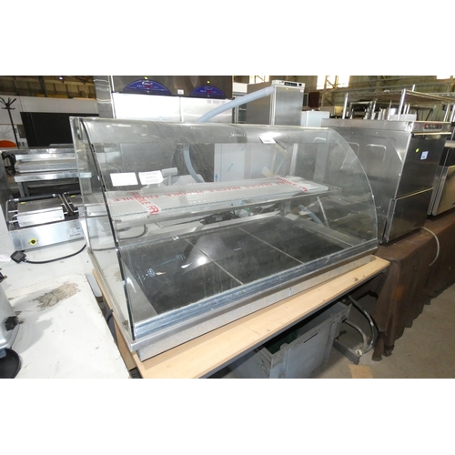 1090 - A commercial stainless steel integrated (drop in counter top) serve over, glass front, heat plate un... 