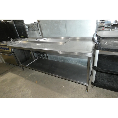 1133 - A commercial stainless steel catering type table with shelf beneath approx 210x70cm