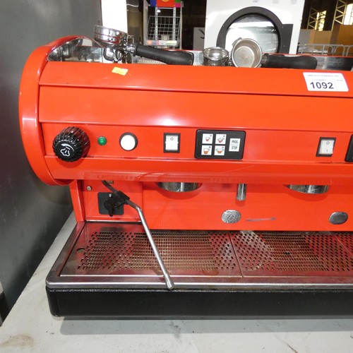 1092 - A large red commercial stainless steel coffee machine by Astoria - no model visible, 3 group, 2 stea... 
