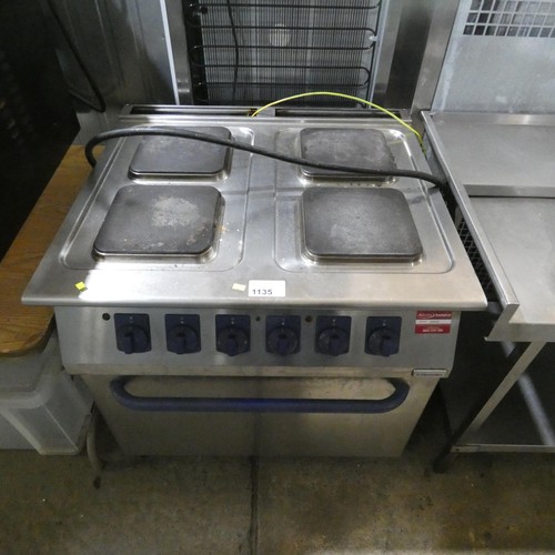 1135 - An electric 4 ring range with oven beneath by Electrolux fitted with a red 3 phase industrial plug -... 