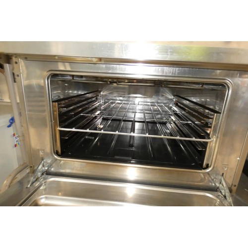 1135 - An electric 4 ring range with oven beneath by Electrolux fitted with a red 3 phase industrial plug -... 