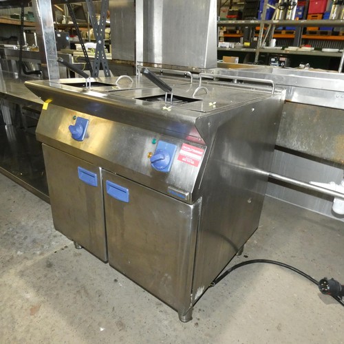 1137 - A commercial stainless steel twin basket deep fryer by Electrolux, fitted with a red industrial 3 ph... 