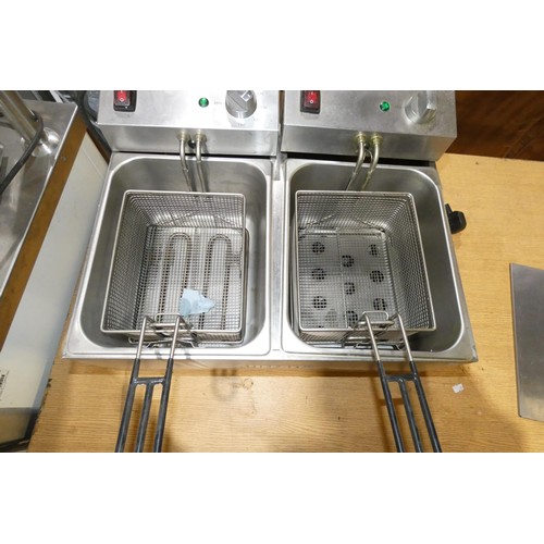 1152 - A commercial stainless steel twin basket deep fryer by Buffalo, 240v - trade