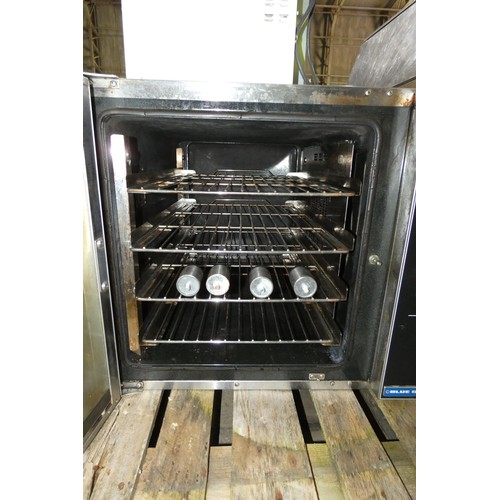 1162 - A commercial stainless steel counter top turbo fan oven by Blue Seal, legs inside, model E32D4. 240V... 