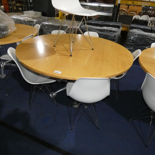 1328 - A large round wood effect table with decorative aluminium metal base approx 150cm