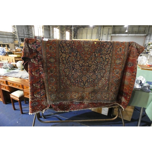 A red ground bokhara style rug and a multicolored oriental medallion