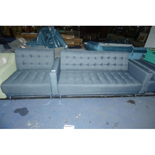 611 - A blue upholstered click / clack sofa bed and one matching chair. Please note note that the chair is... 