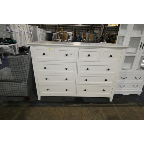 614 - A white chest of 8 drawers approx 153cm wide. Please note that this chest of drawers has a damage to... 