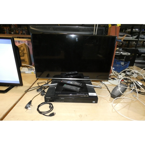 2397 - A 32 inch HD TV by Samsung type T32E390SX comes with a stand, a Samsung dvd recorder, Sony dvd  
 re... 