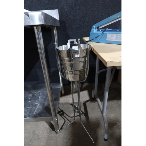 1197 - A stainless steel champagne bucket and stand