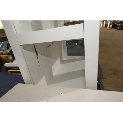 615 - A white two door display cabinet approx 66cm w x 177cm high. Please note that this cabinet has damag... 