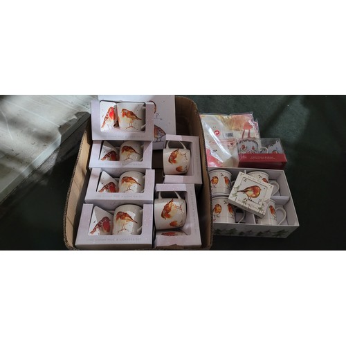 2435 - A quantity of various robin patterned mugs, coasters etc. Contents of 1 box