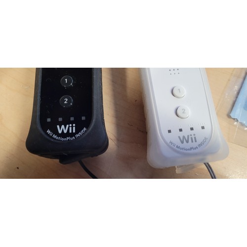 2392 - A Nintendo Wii U premium console, Wii backwards compatible, with touch screen controller, 2 Wii plus... 