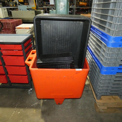 6770 - 1 x red plastic wheeled tub containing 21 x black plastic trays (in two sizes)